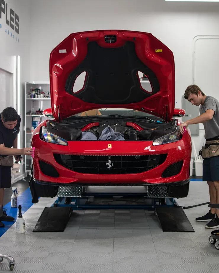 two guys applying paint protection film