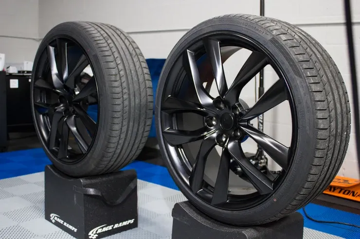 Two tires are stacked on top of each other