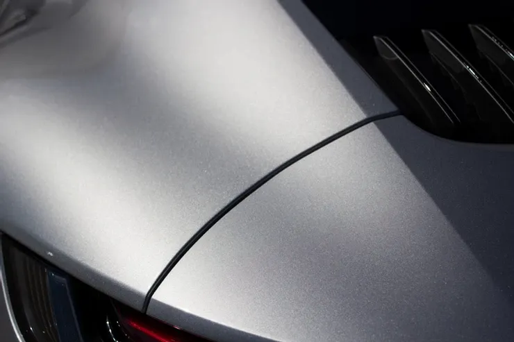 A close up of the back of a silver car