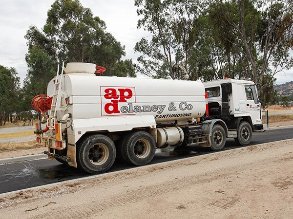 A white truck with ap delaney & co. written on the side