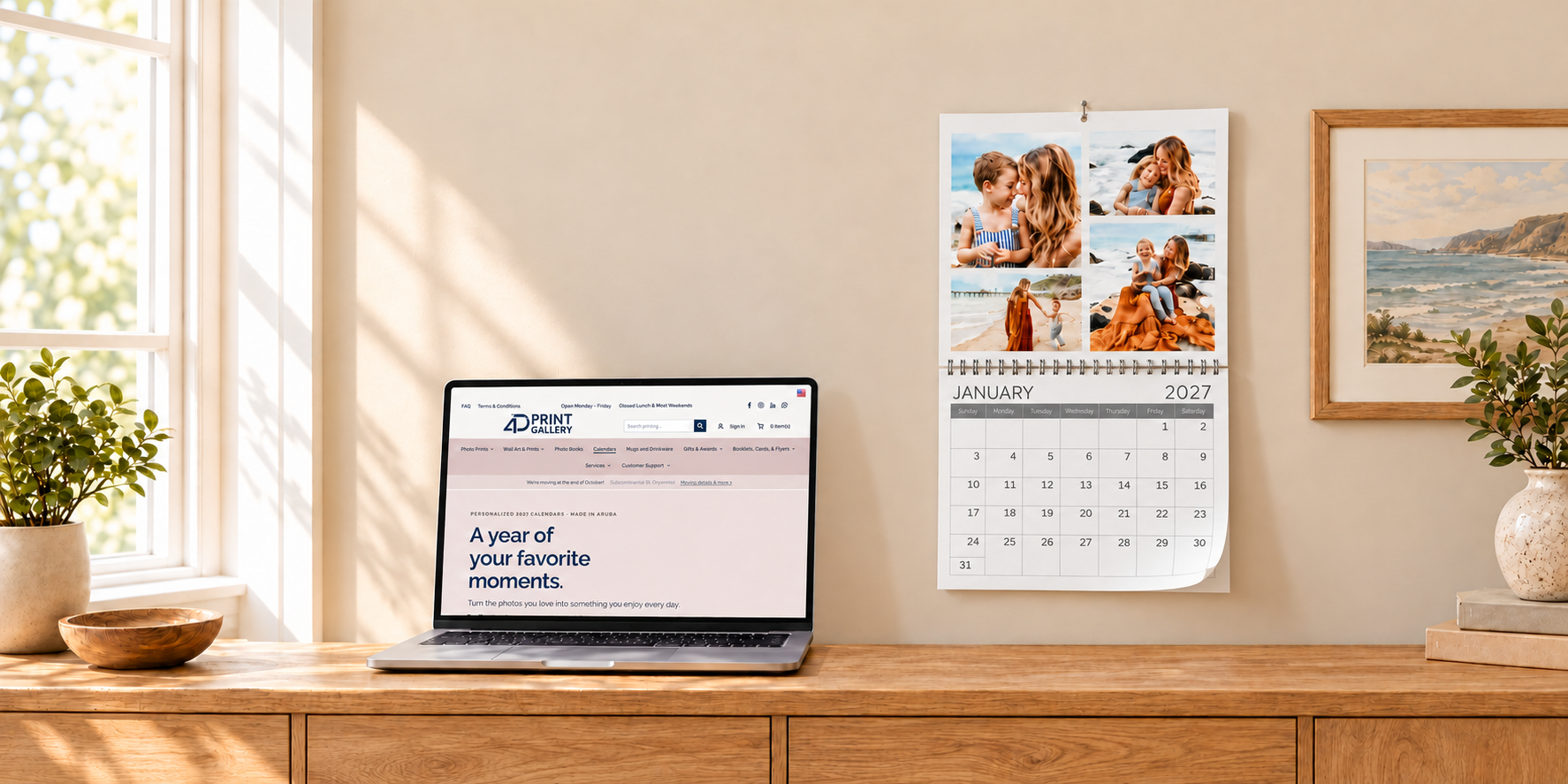 Family photo calendar with one center binding beside a laptop displaying our calendar website