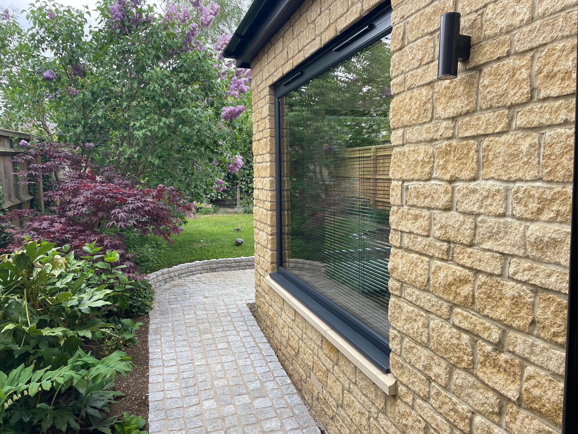 Rear house extension in Witney with granite cobbles.