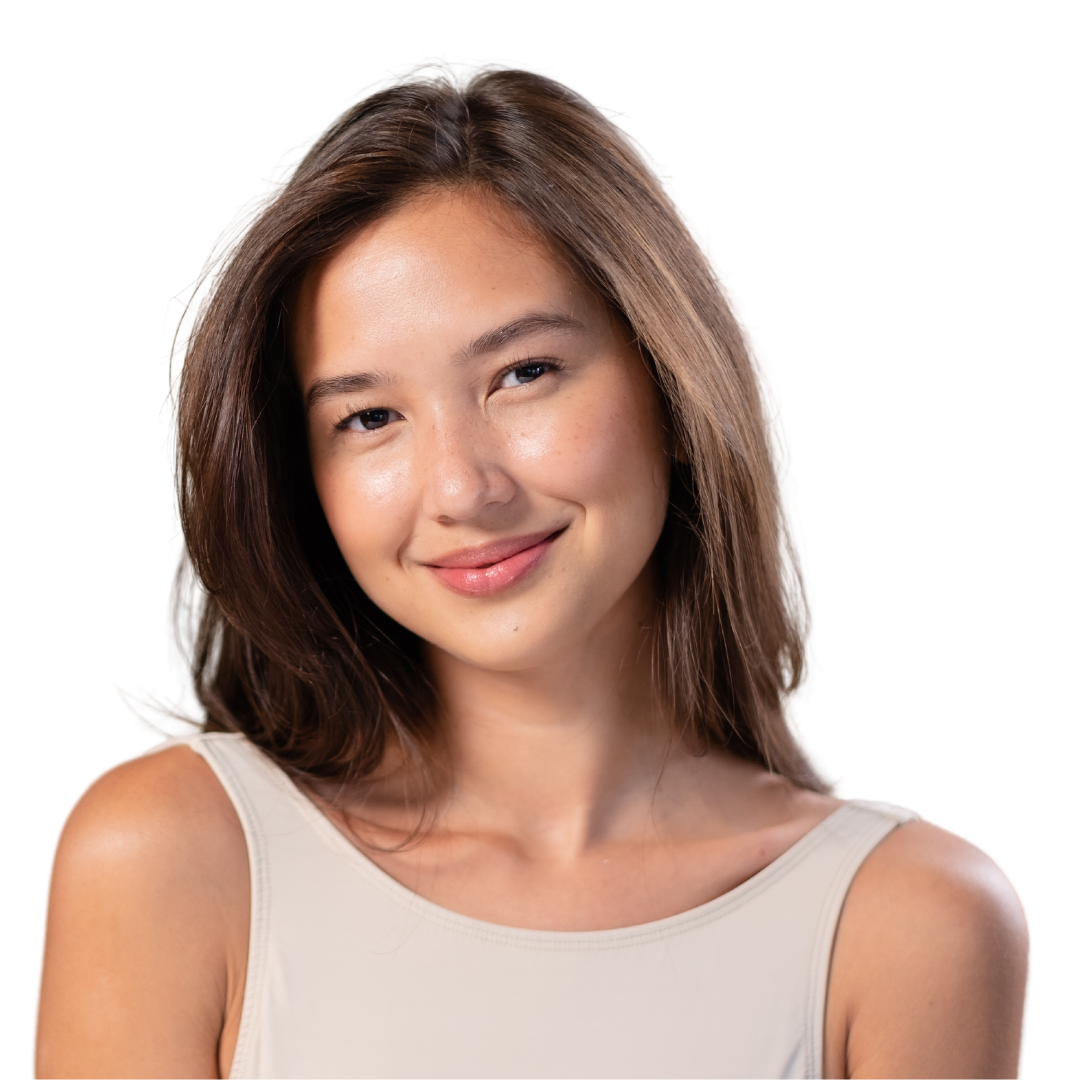 A woman in a white tank top smiles for the camera