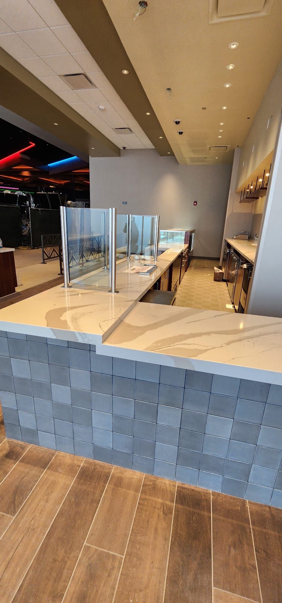 There is a long counter in the middle of the room.