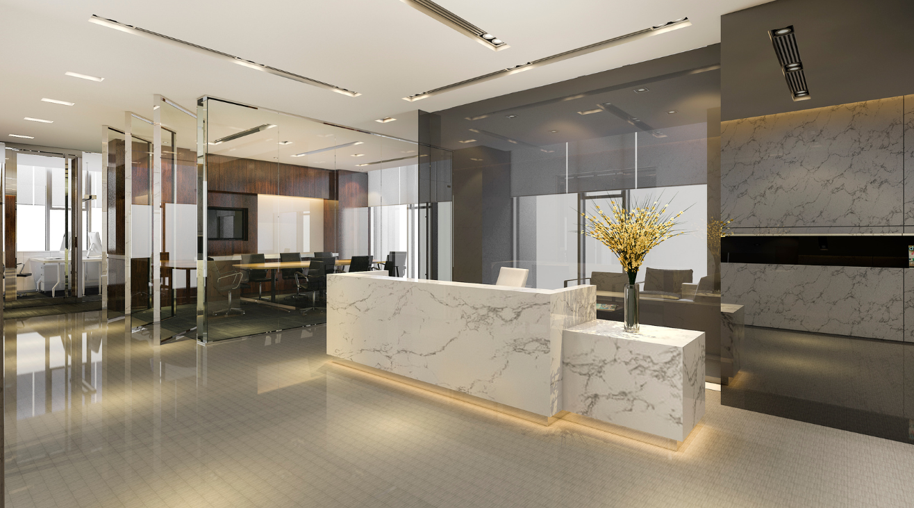 There is a marble reception desk in the middle of the room.