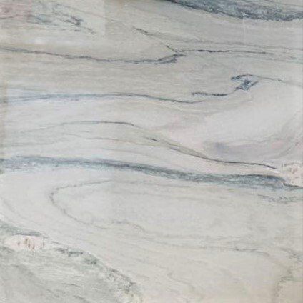 A close up of a white marble tile with a swirl pattern.