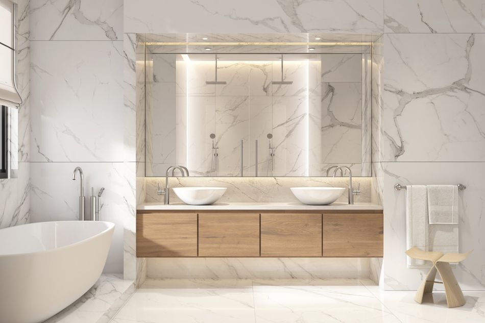 A bathroom with two sinks , a tub , and a shower.