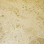 A close up of a marble counter top with spots on it.