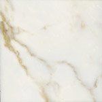 A close up of a white marble tile with a gold border.