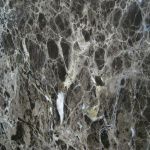 A close up of a marble surface with a lot of holes in it.