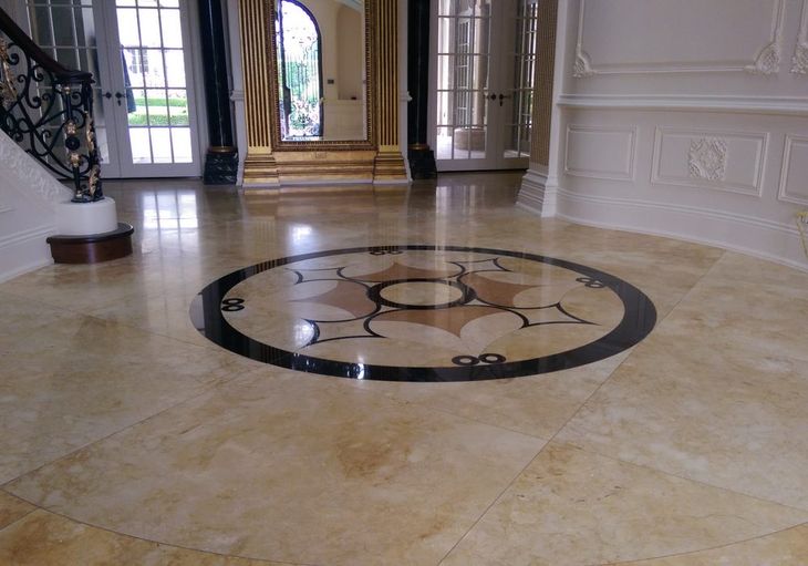 A marble floor with a circular design in the middle