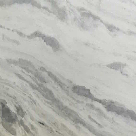 A close up of a white marble counter top with a gray marble texture.