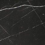 A close up of a black marble tile with white veins.