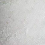 A close up of a white surface with a texture.