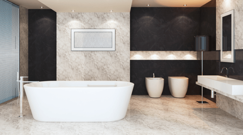 A bathroom with a bathtub and two sinks