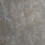 A close up of a tile floor with a marble texture.