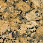 A close up of a yellow granite counter top.