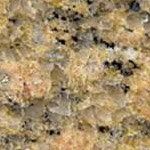 A close up of a yellow granite counter top.