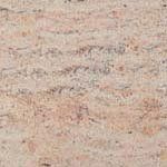A close up of a pink granite counter top.