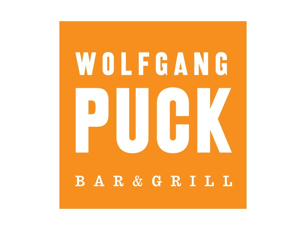 A logo for wolfgang puck bar and grill