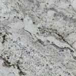 A close up of a white granite counter top.