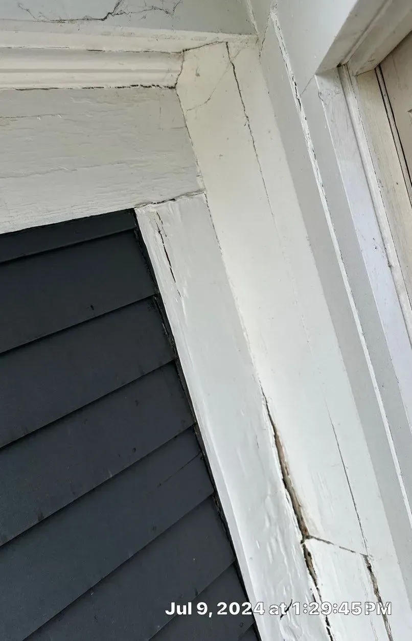 A close up of a window frame on a house
