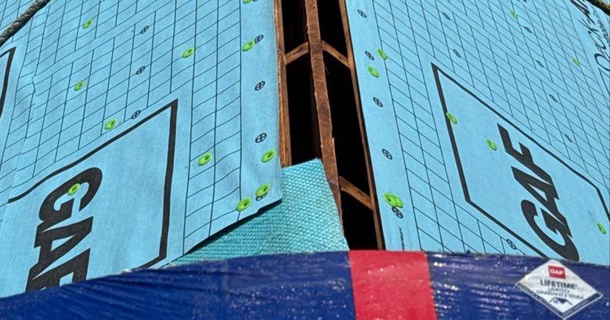 Master Roof working on ventilation problems
