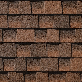 A close up of a row of red shingles on a roof.