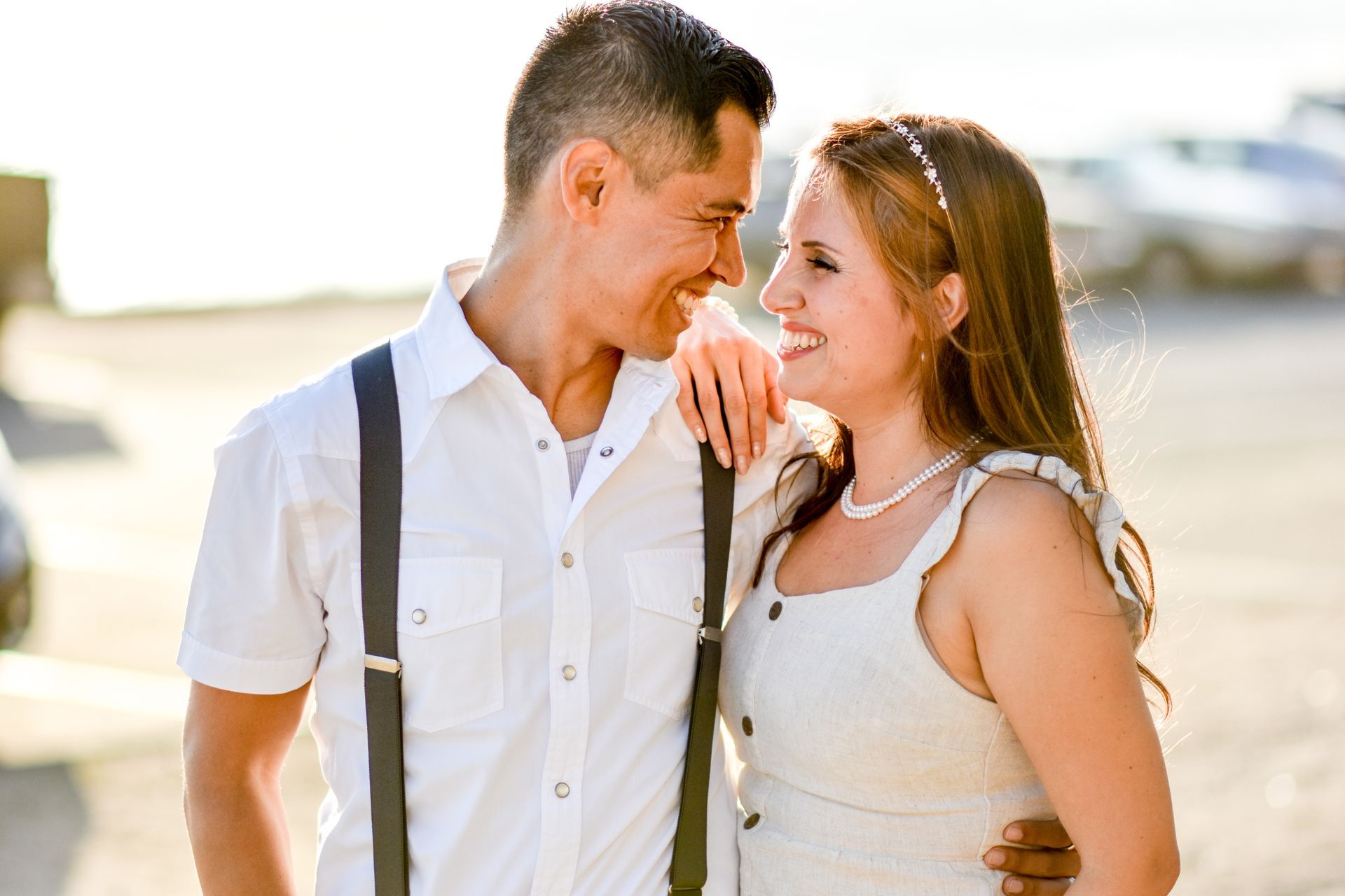 A man and a woman are standing next to each other and looking at each other in San Pedro, CA