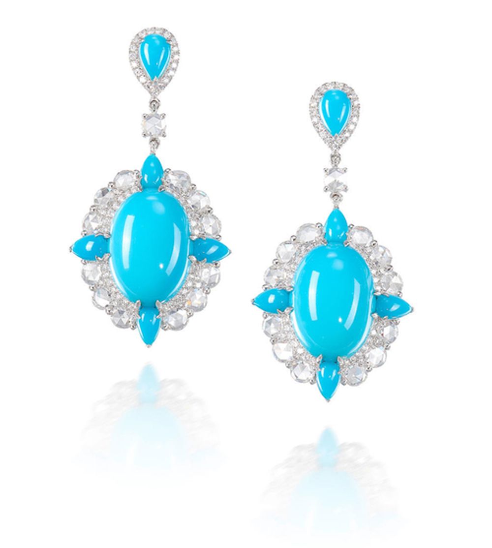Turquoise and diamond teardrop earrings on a white background