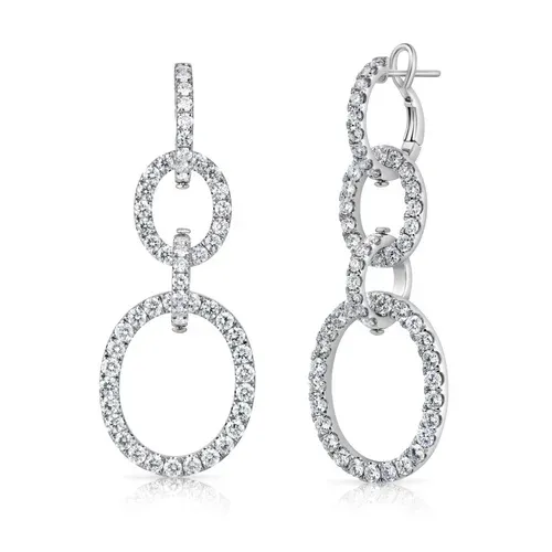 Pair of silver oval drop earrings with clear crystal accents on a white background