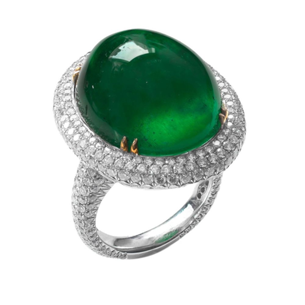 Emerald cabochon ring with silver band and diamond halo