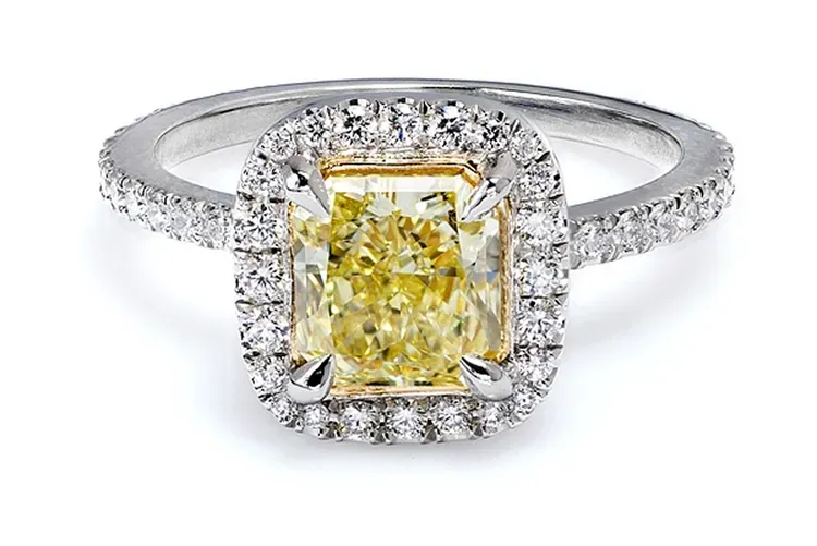 Yellow diamond halo engagement ring with a rectangular center stone and silver band Yellow diamond halo engagement ring with a rectangular center stone and silver band