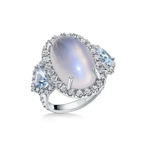 Silver ring with oval moonstone and blue gemstone accents