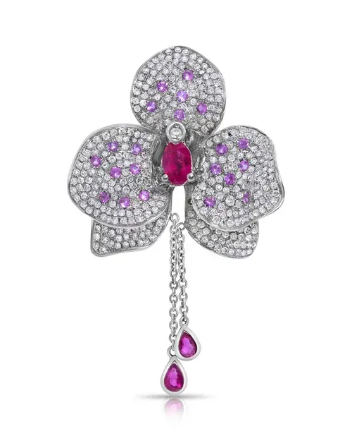 Silver butterfly brooch with pink gemstones and dangling teardrop pendants