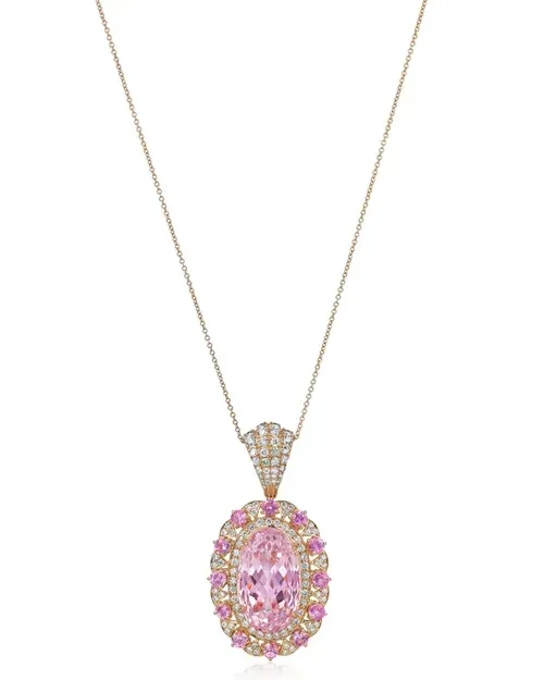 Gold necklace with a pink oval jeweled pendant and matching clear stones Gold necklace with a pink oval jeweled pendant and matching clear stones