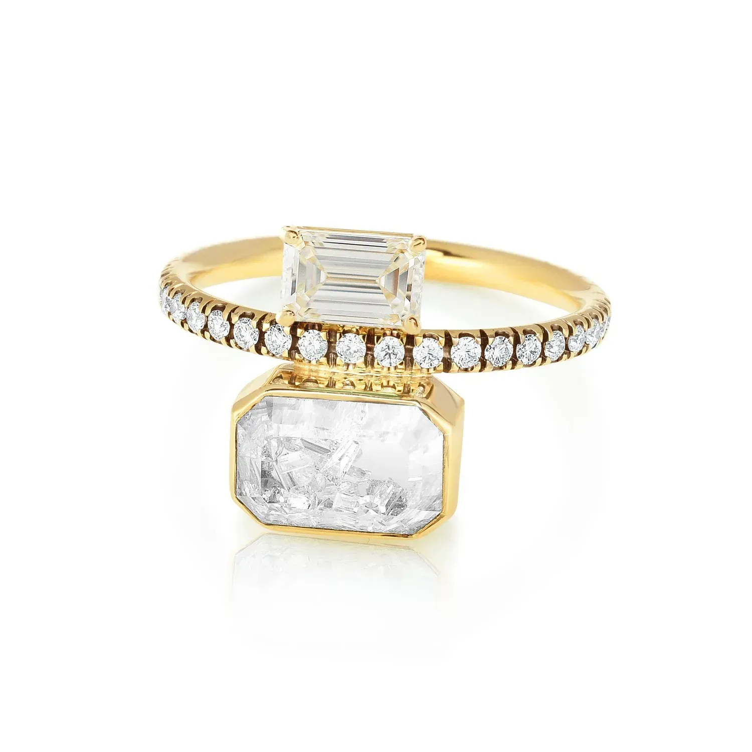 Gold ring with rectangular clear gemstones, featuring a pavé band and a dangling stone setting