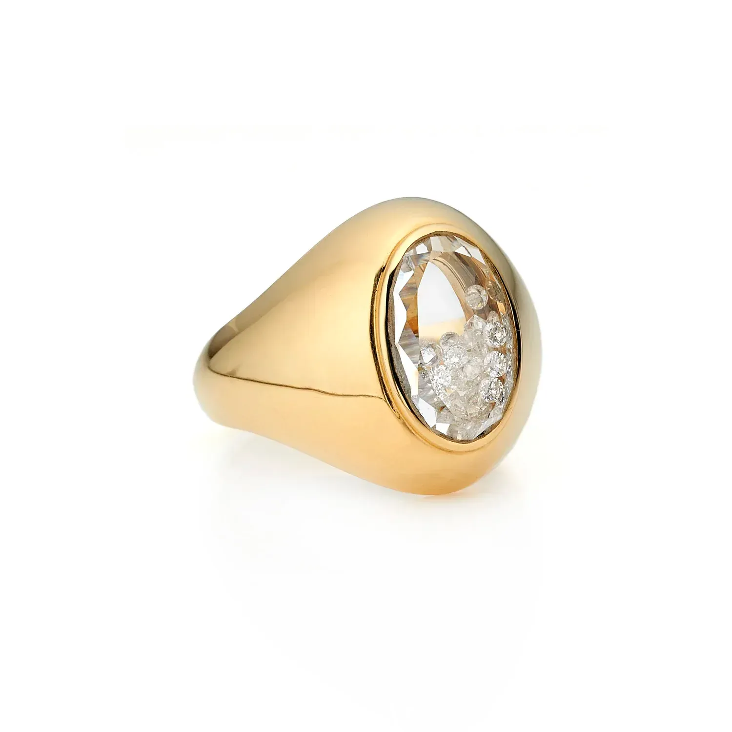 Gold ring with an oval white gemstone and sparkling crystal accents