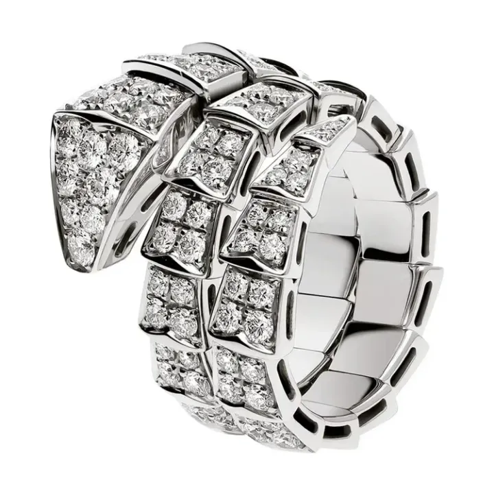Diamond-studded silver ring with a bold, sculpted geometric design Diamond-studded silver ring with a bold, sculpted geometric design