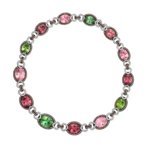 Colorful oval gemstone bracelet with pink, green, and red stones in silver settings