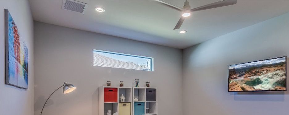 living room with awning window on the top side of the walll