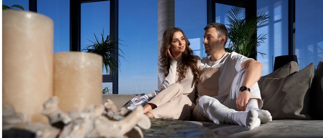 couple on a couch with natural light