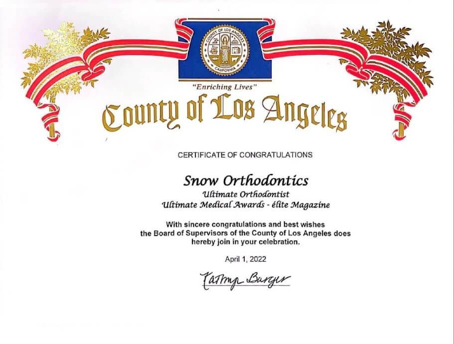 County of Los Angeles certificate honoring Snow Orthodontics with decorative red and blue banner.