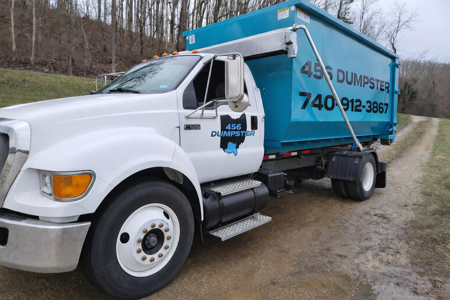 456 Dumpster roll-off truck delivering across southern Ohio