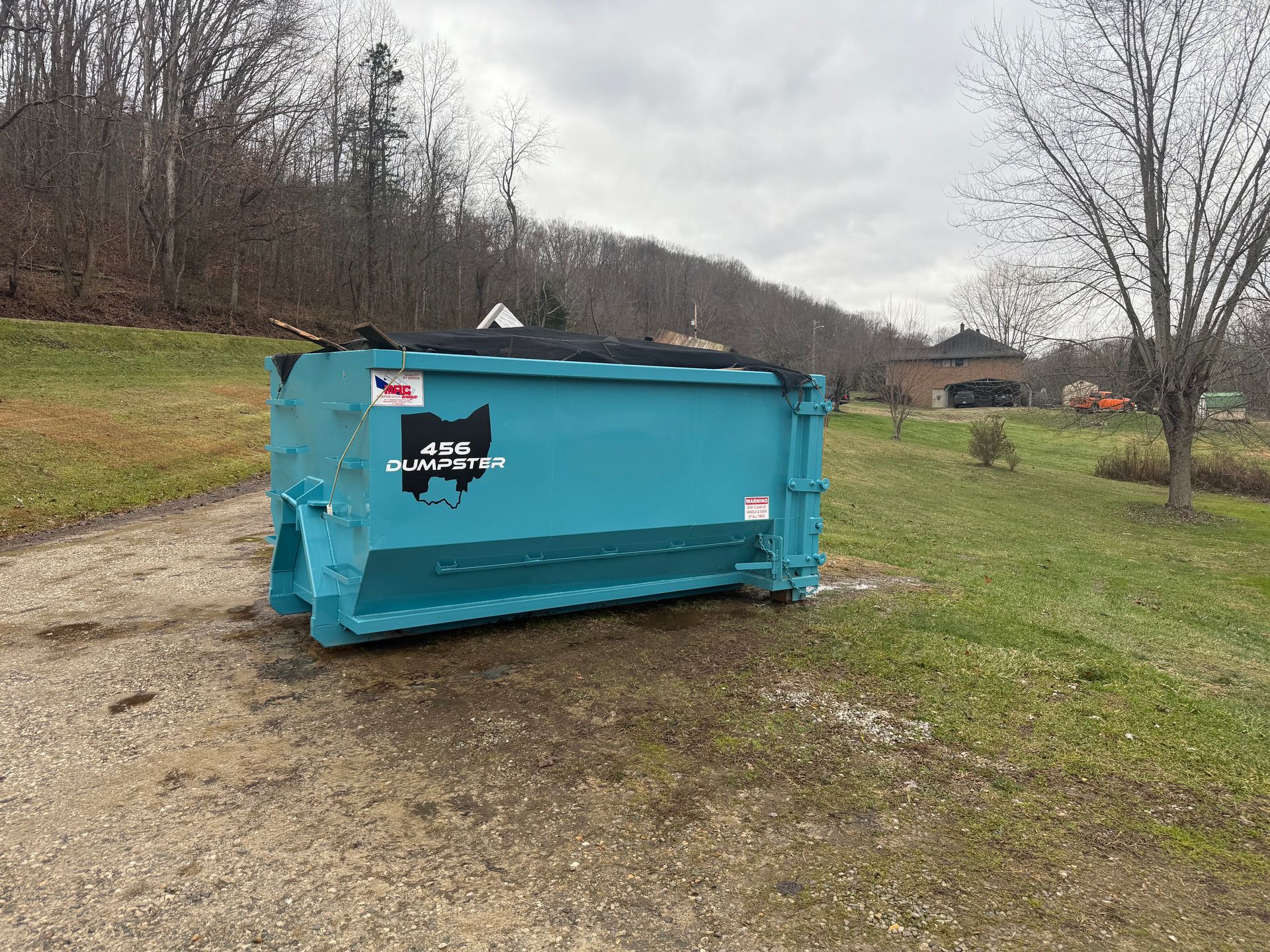 456 Dumpsters 10 yard roll-off in a southern Ohio driveway for a household cleanout