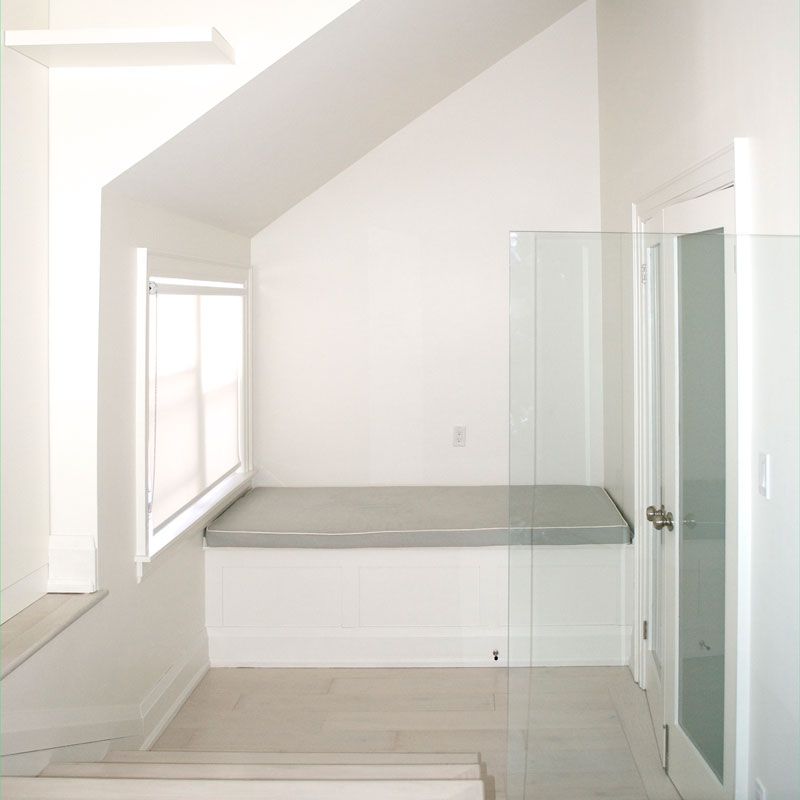 A bathroom with a bathtub and a glass door