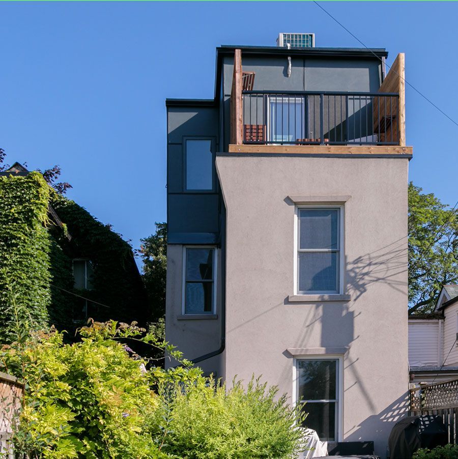 A tall building with a balcony on top of it