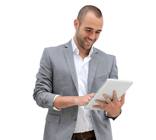 A man in a suit is using a tablet computer.