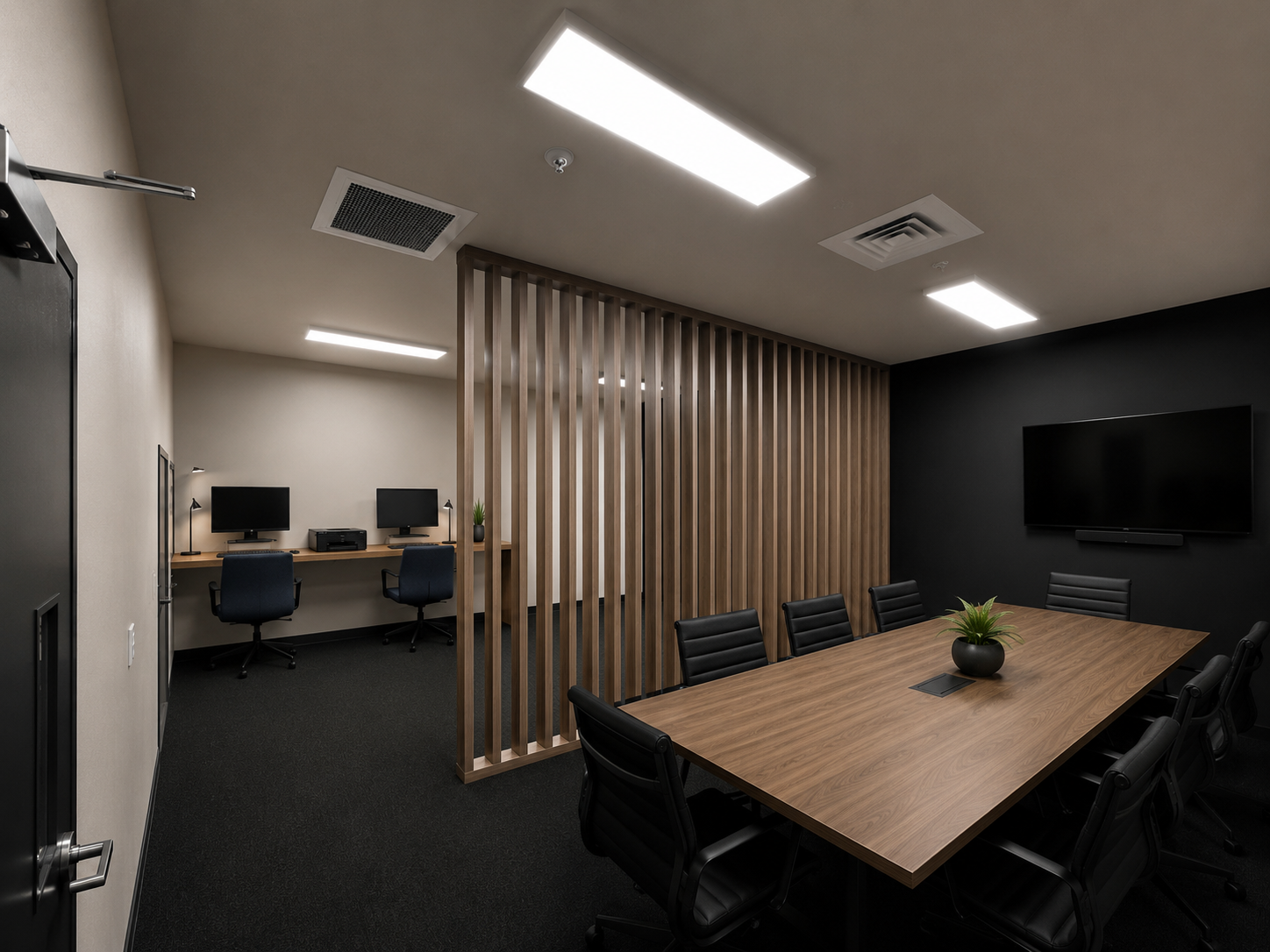 Rendering of an office space with multiple computers and a conference table