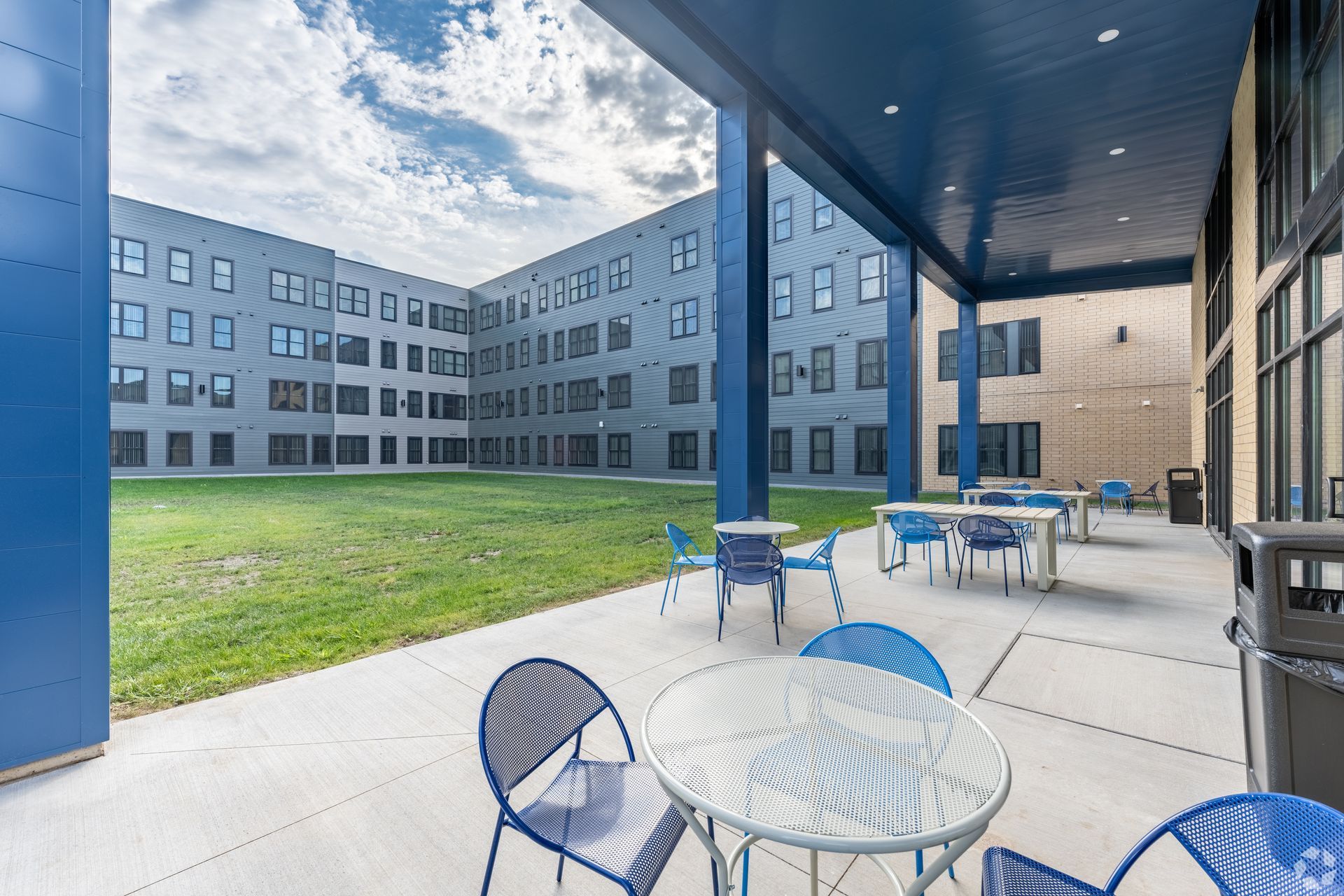 Exterior patio space within a multifamily apartment building.